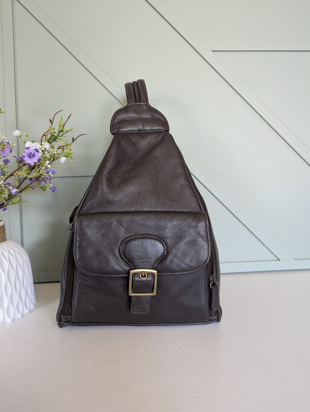 Vintage Aurielle brown leather sling backpack,